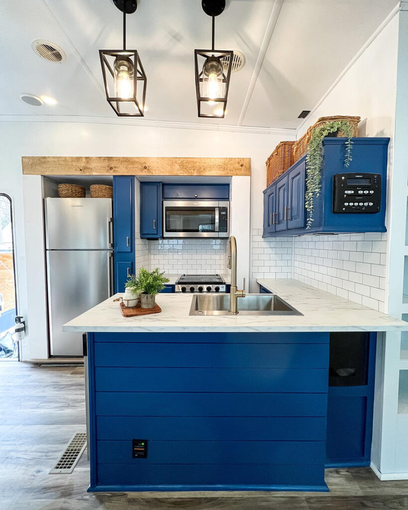 RV with blue kitchen cabinets