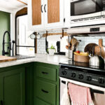 family-friendly camper kitchen with green cabinets